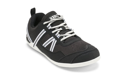 Xero Shoes Canada, specifically women’s barefoot shoes Canada. These minimalist shoes have flexible soles, wide toe boxes, and zero drop. Angled view of Xero Women's Prio  in Black/White. A running and fitness shoe. 