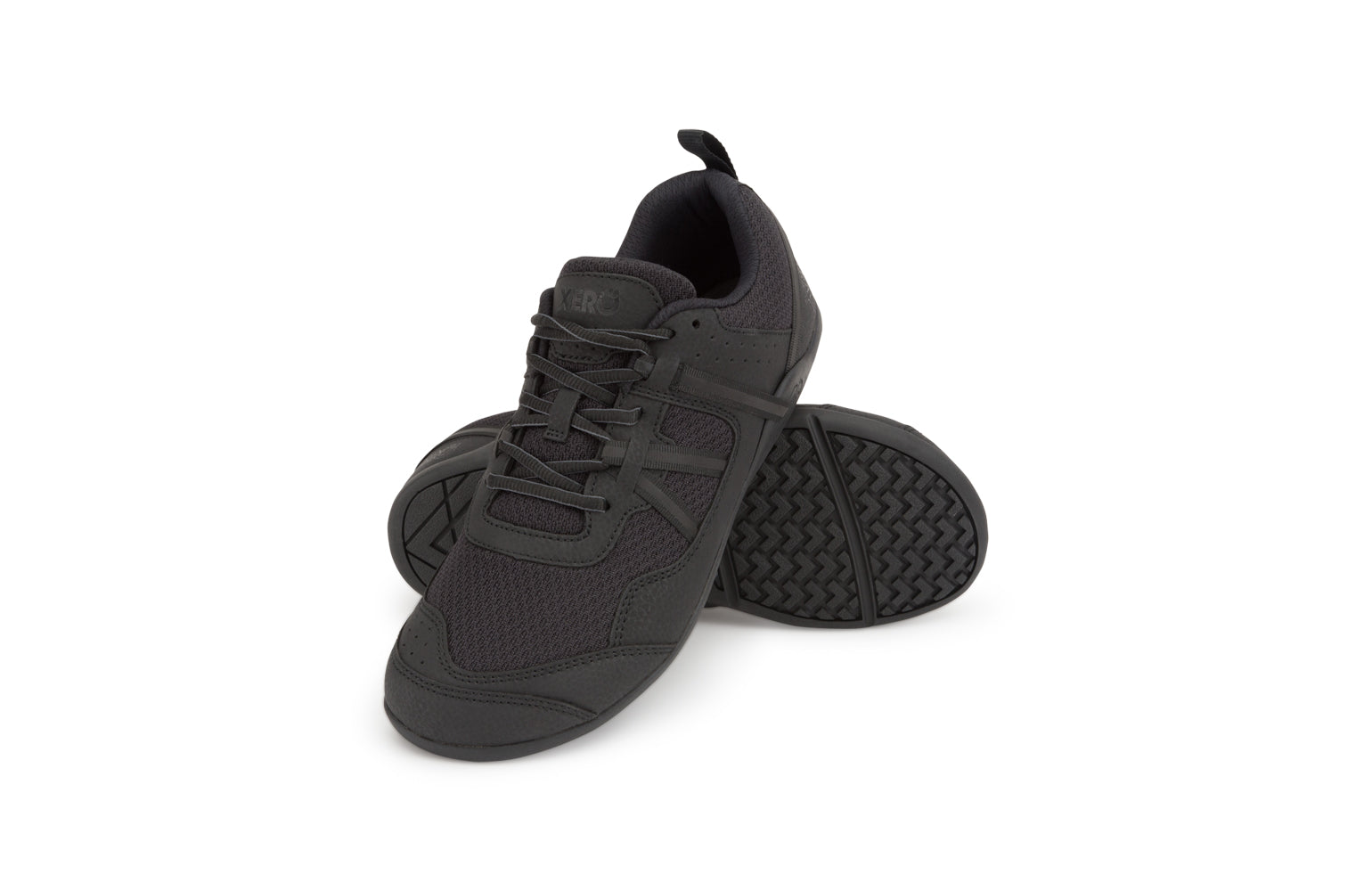 Xero Barefoot Shoes sold in Ontario, Canada. These minimalist shoes have flexible soles, wide toe boxes, and zero drop. Angled side view of Xero Men's Prio  in Black. A running and fitness shoe. 