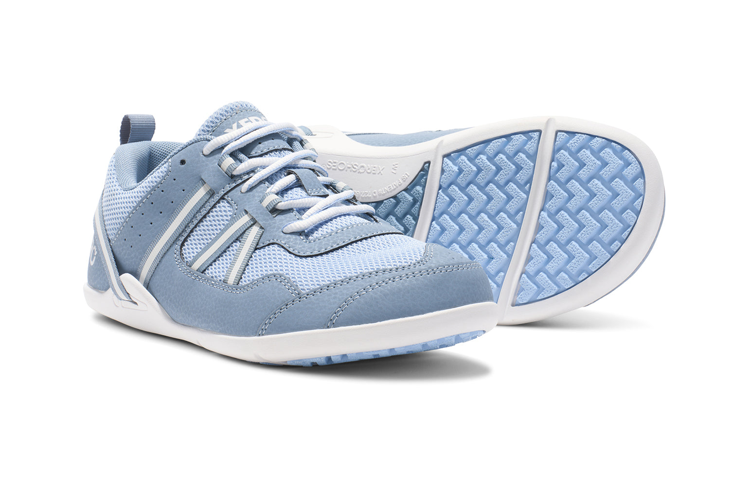 Xero Shoes Canada, specifically women’s barefoot shoes Canada. These minimalist shoes have flexible soles, wide toe boxes, and zero drop. Pair view of Xero Women's Prio in Dusty Blue. A running and fitness shoe. 