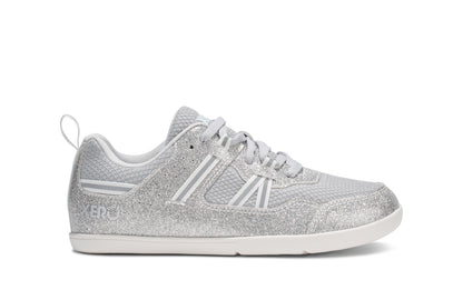 Xero Barefoot Shoes for kids sold in Ontario, Canada. These minimalist shoes have flexible soles, wide toe boxes, and zero drop. Side view of Xero Kid's Prio in Silver Glitter. Casual kid's sneaker.