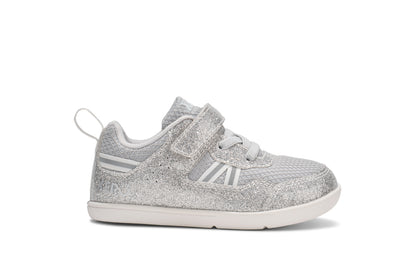 Xero Barefoot Shoes for little kids sold in Ontario, Canada. These minimalist shoes have flexible soles, wide toe boxes, and zero drop. Side view of Xero Little Kid's Prio in Silver Glitter. Casual kid's sneaker.