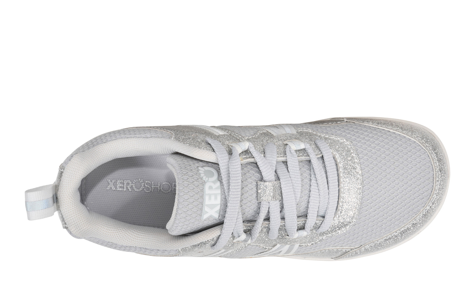Xero Barefoot Shoes for kids sold in Ontario, Canada. These minimalist shoes have flexible soles, wide toe boxes, and zero drop. Top view of Xero Kid's Prio in Silver Glitter. Casual kid's sneaker.