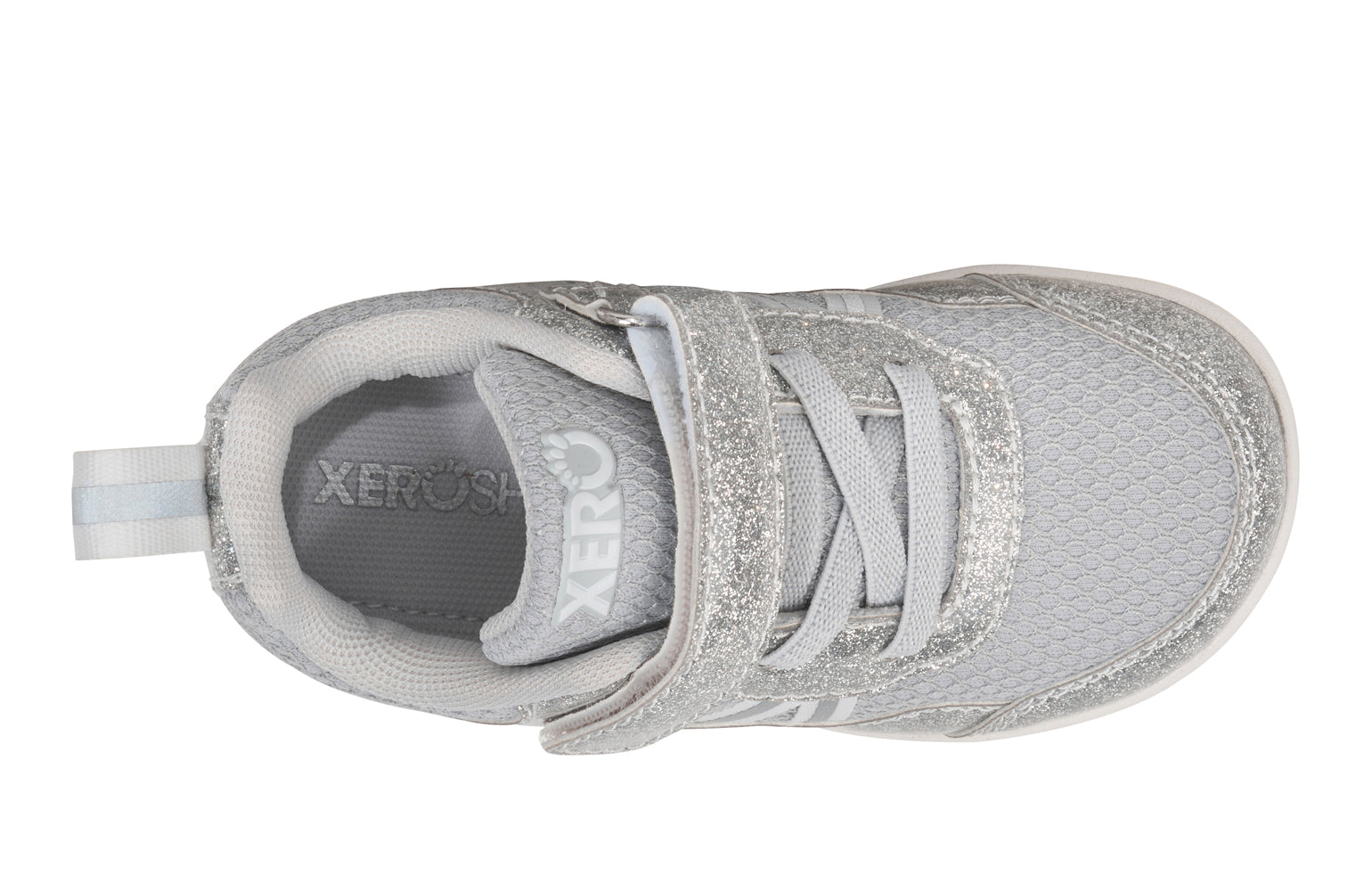 Xero Barefoot Shoes for little kids sold in Ontario, Canada. These minimalist shoes have flexible soles, wide toe boxes, and zero drop. Top view of Xero Little Kid's Prio in Silver Glitter. Casual kid's sneaker.