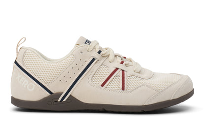 White athletic shoe with red and blue accents on a white background.  Tru Stride Co brings Xero Shoes to Canada