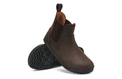 Xero Shoes Canada, specifically men’s barefoot shoes Canada. These minimalist shoes have flexible soles, wide toe boxes, and zero drop. Angled pair view of Men's Ridgeway Chelsea in Dark Brown, a versatile boot.