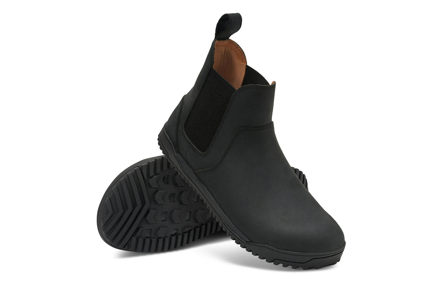 Xero Barefoot Shoes sold in Ontario, Canada. These minimalist shoes have flexible soles, wide toe boxes, and zero drop. Angled pair view of Men's Ridgeway Chelsea in Black, a versatile boot.