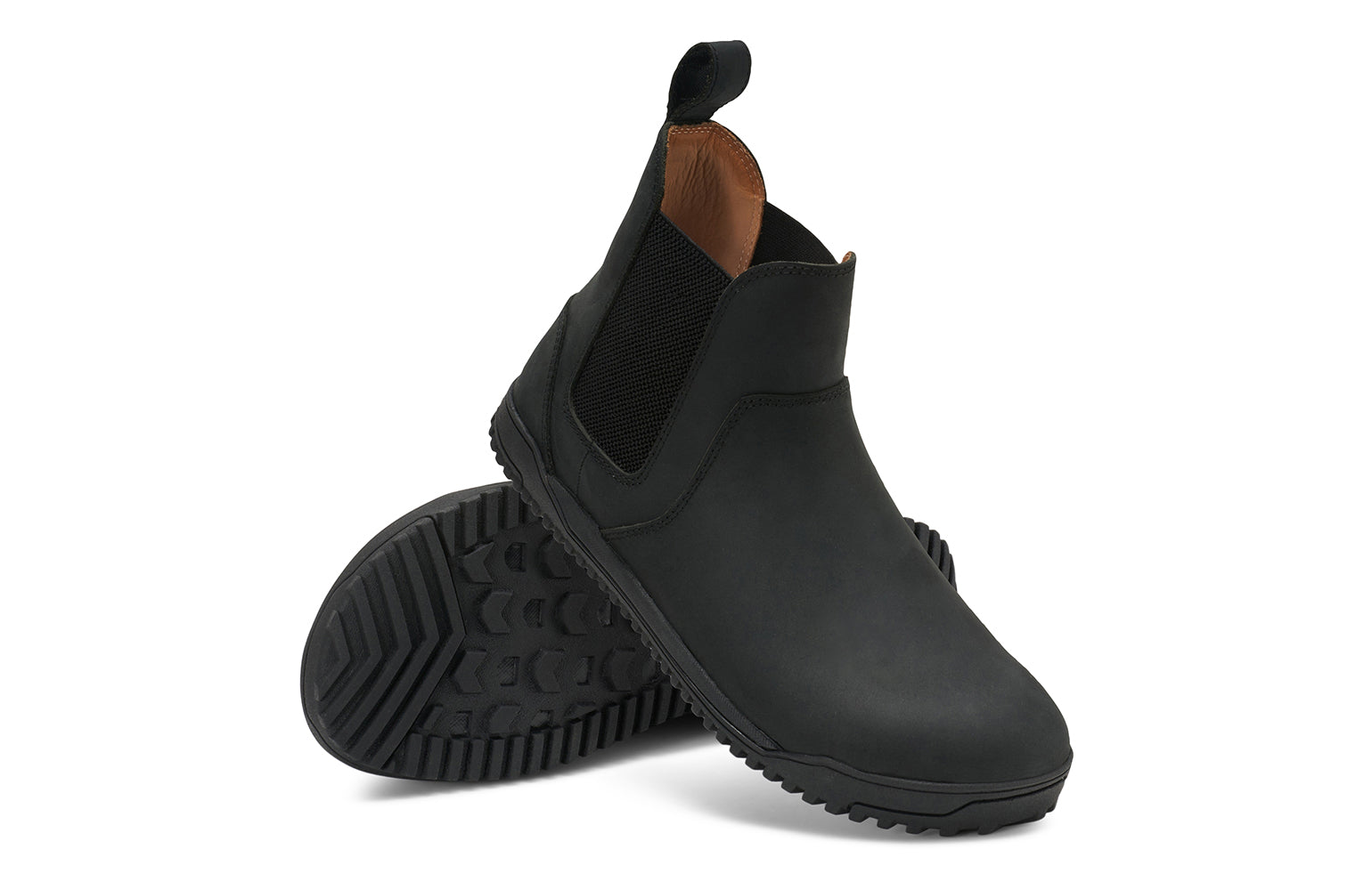 Xero Barefoot Shoes sold in Ontario, Canada. These minimalist shoes have flexible soles, wide toe boxes, and zero drop. Angled pair view of Men's Ridgeway Chelsea in Black, a versatile boot.