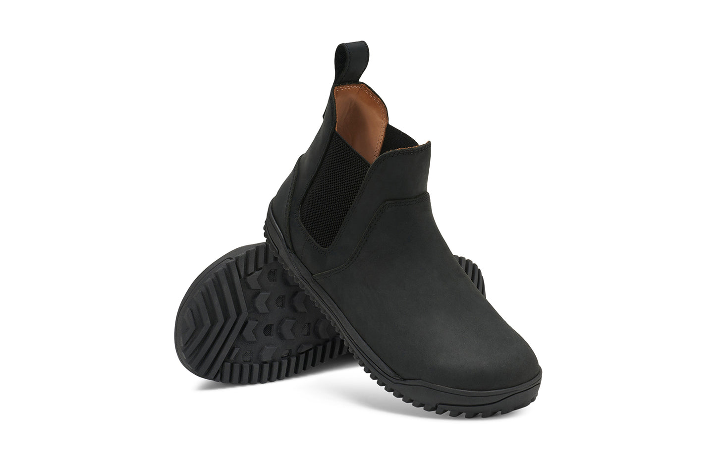 Xero Barefoot Shoes sold in Ontario, Canada. These minimalist shoes have flexible soles, wide toe boxes, and zero drop. Angled pair view of Women's Ridgeway Chelsea in Black, a versatile boot.