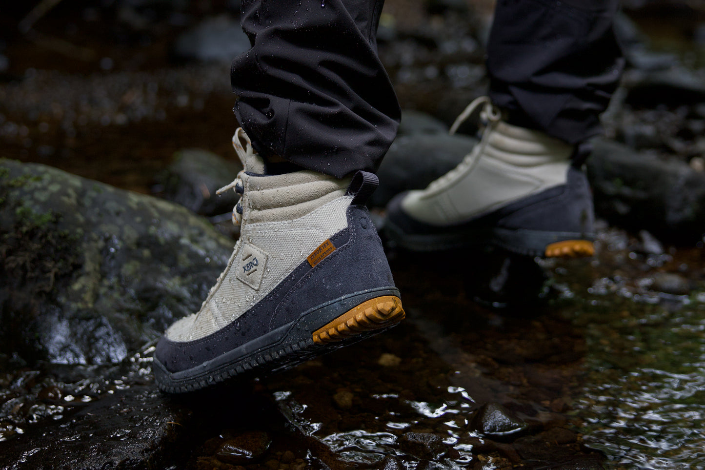 Xero Shoes Canada, specifically barefoot hiking shoes Canada. Woman wearing Ridgeway on slippery rocks
