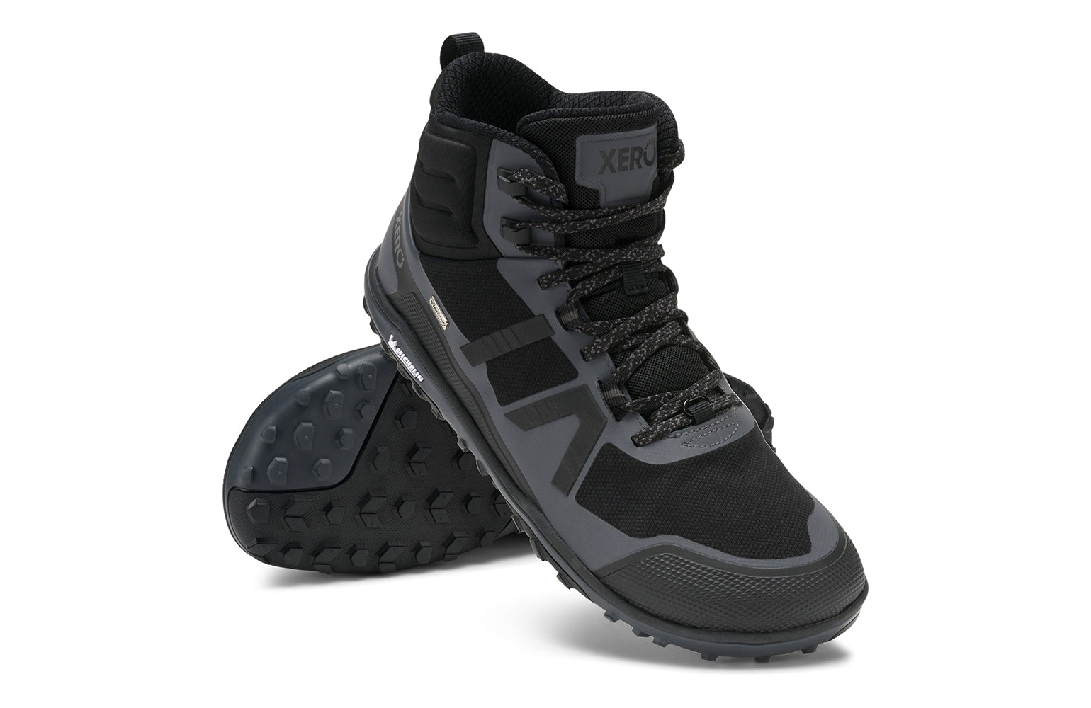 Xero Barefoot Shoes sold in Ontario, Canada. These minimalist shoes have flexible soles, wide toe boxes, and zero drop. Angled pair view of Xero Men's Scrambler Mid II WP in Black/Asphalt, a lightweight waterproof hiking shoe. 