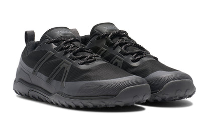 Xero Shoes Canada, specifically barefoot hiking shoes Canada. These minimalist shoes have flexible soles, wide toe boxes, and zero drop. Angled view of Xero Men's Scrambler Trail Low WP in Black Asphalt, a sturdy hiking shoe