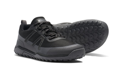 Xero Shoes Canada, specifically barefoot hiking shoes Canada. These minimalist shoes have flexible soles, wide toe boxes, and zero drop. Side and sole view of Xero Women's Scrambler Trail Low WP in Black/Asphalt - a sturdy hiking shoe