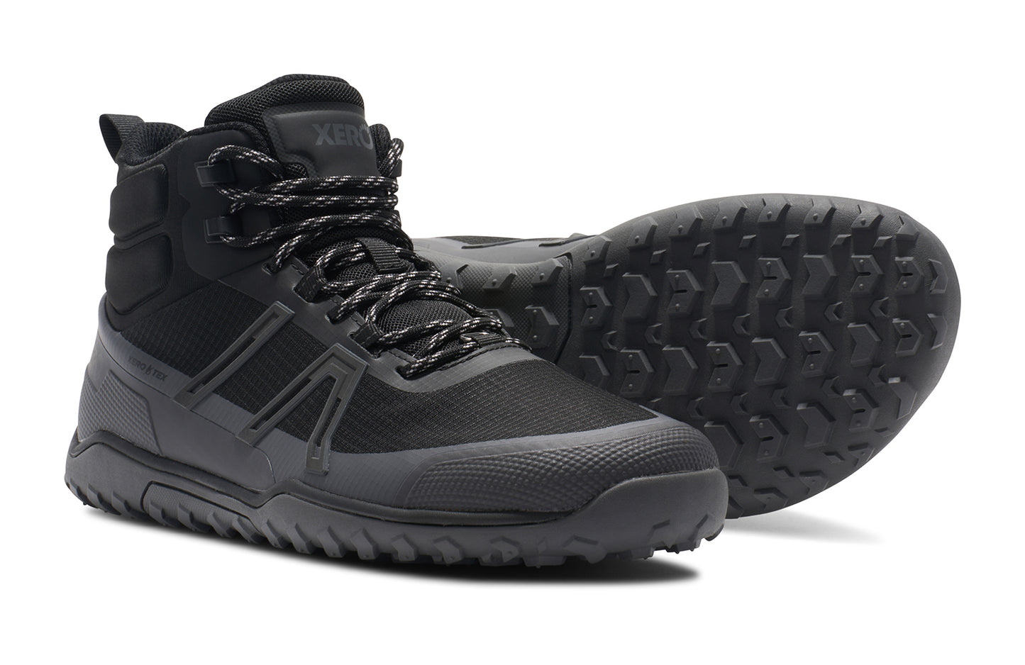Xero Shoes Canada, specifically barefoot hiking shoes Canada. These minimalist shoes have flexible soles, wide toe boxes, and zero drop. Side and sole view of Xero Men's Scrambler Trail Mid WP in Black/Asphalt - a sturdy hiking boot