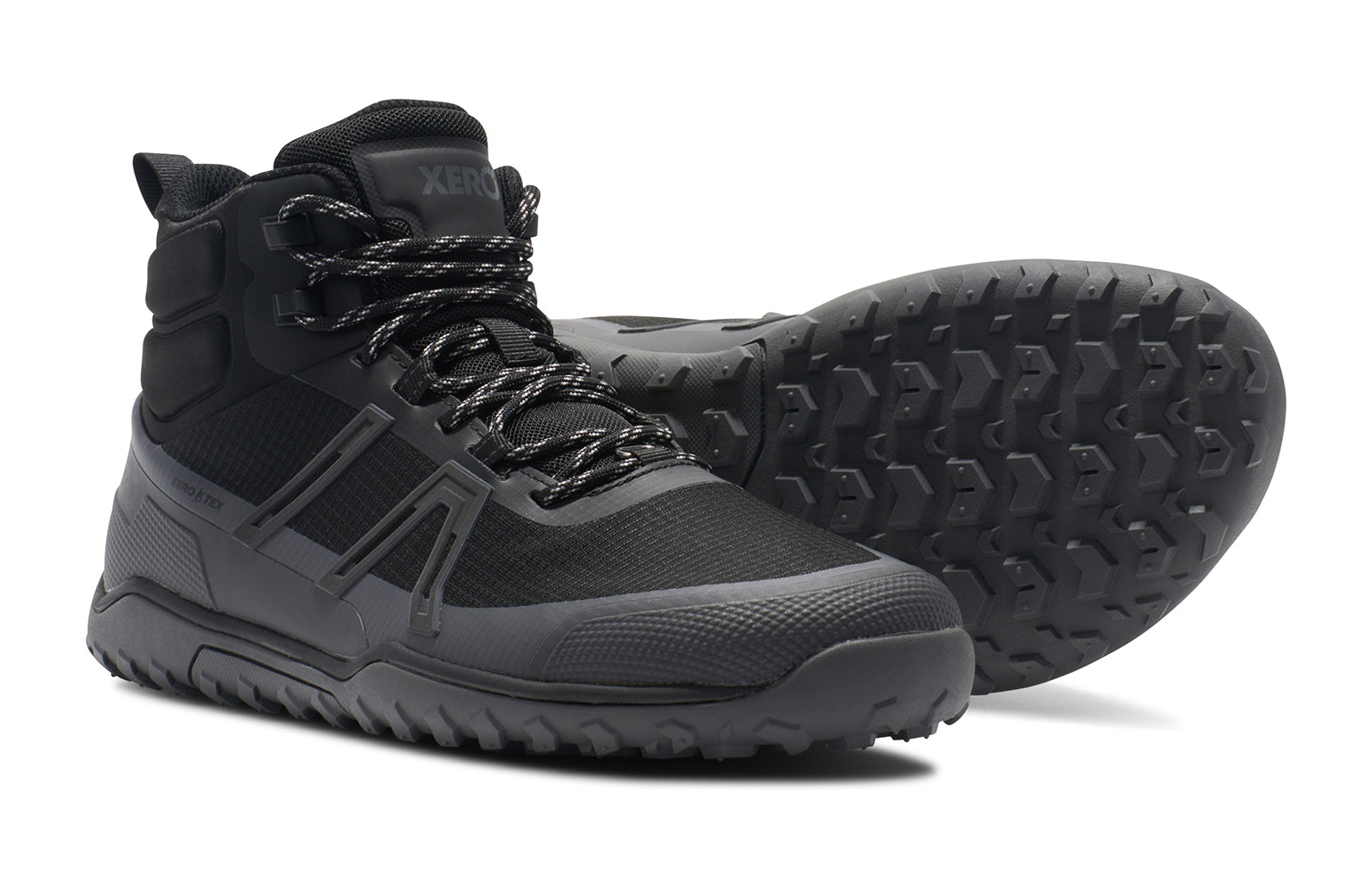 Xero Shoes Canada, specifically barefoot hiking shoes Canada. These minimalist shoes have flexible soles, wide toe boxes, and zero drop. Side and sole view of Xero Men's Scrambler Trail Mid WP in Black/Asphalt - a sturdy hiking boot