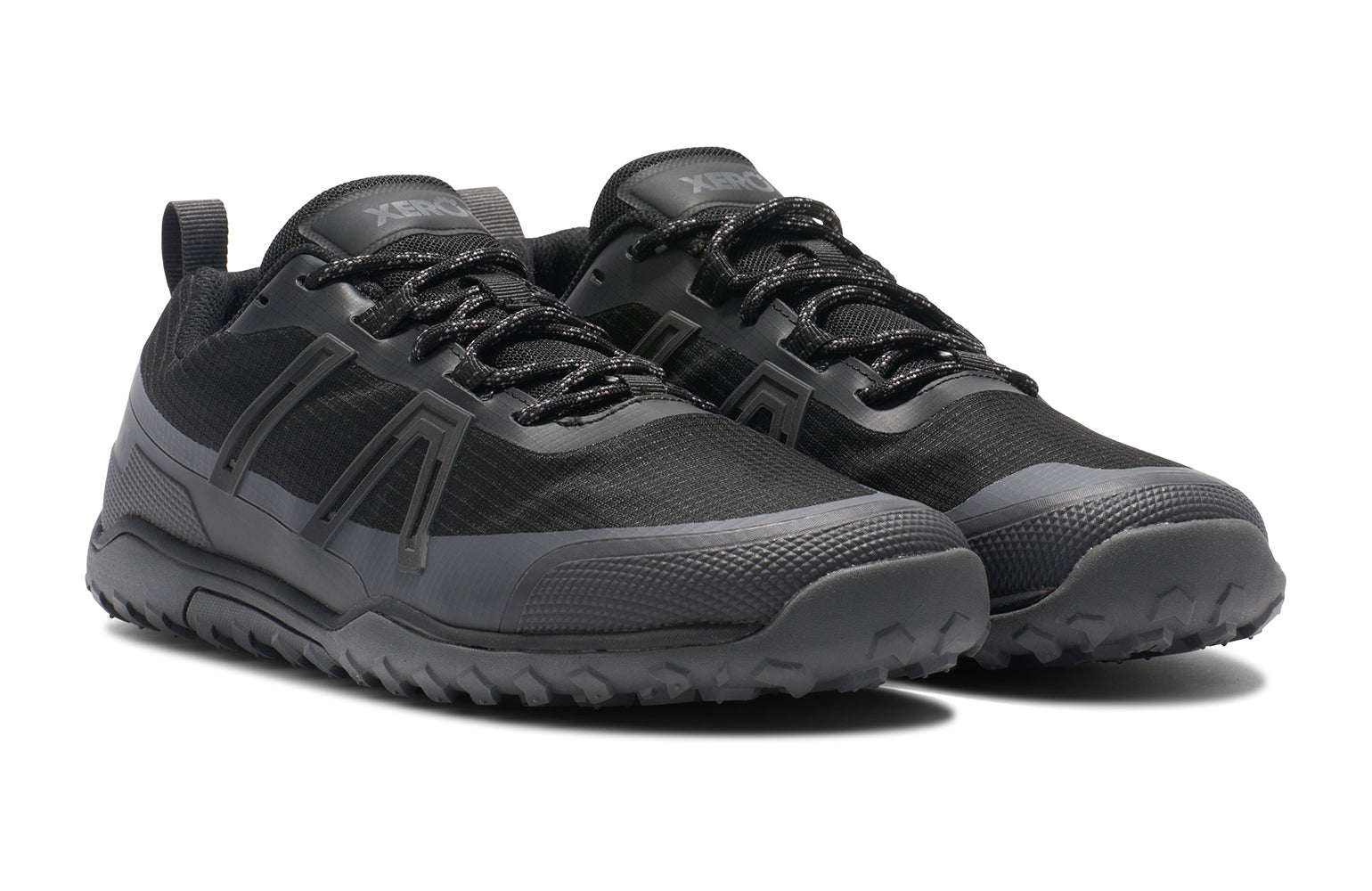 Xero Barefoot Shoes sold in Ontario, Canada. These minimalist shoes have flexible soles, wide toe boxes, and zero drop. Angled view of Xero Men's Scrambler Trail Low WP in Black Asphalt, a sturdy hiking shoe