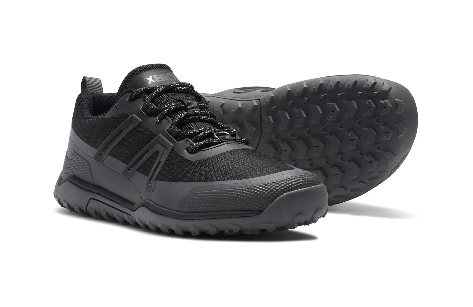 Xero Barefoot Shoes sold in Ontario, Canada. These minimalist shoes have flexible soles, wide toe boxes, and zero drop. Side and sole view of Xero Women's Scrambler Trail Low WP in Black/Asphalt - a sturdy hiking shoe