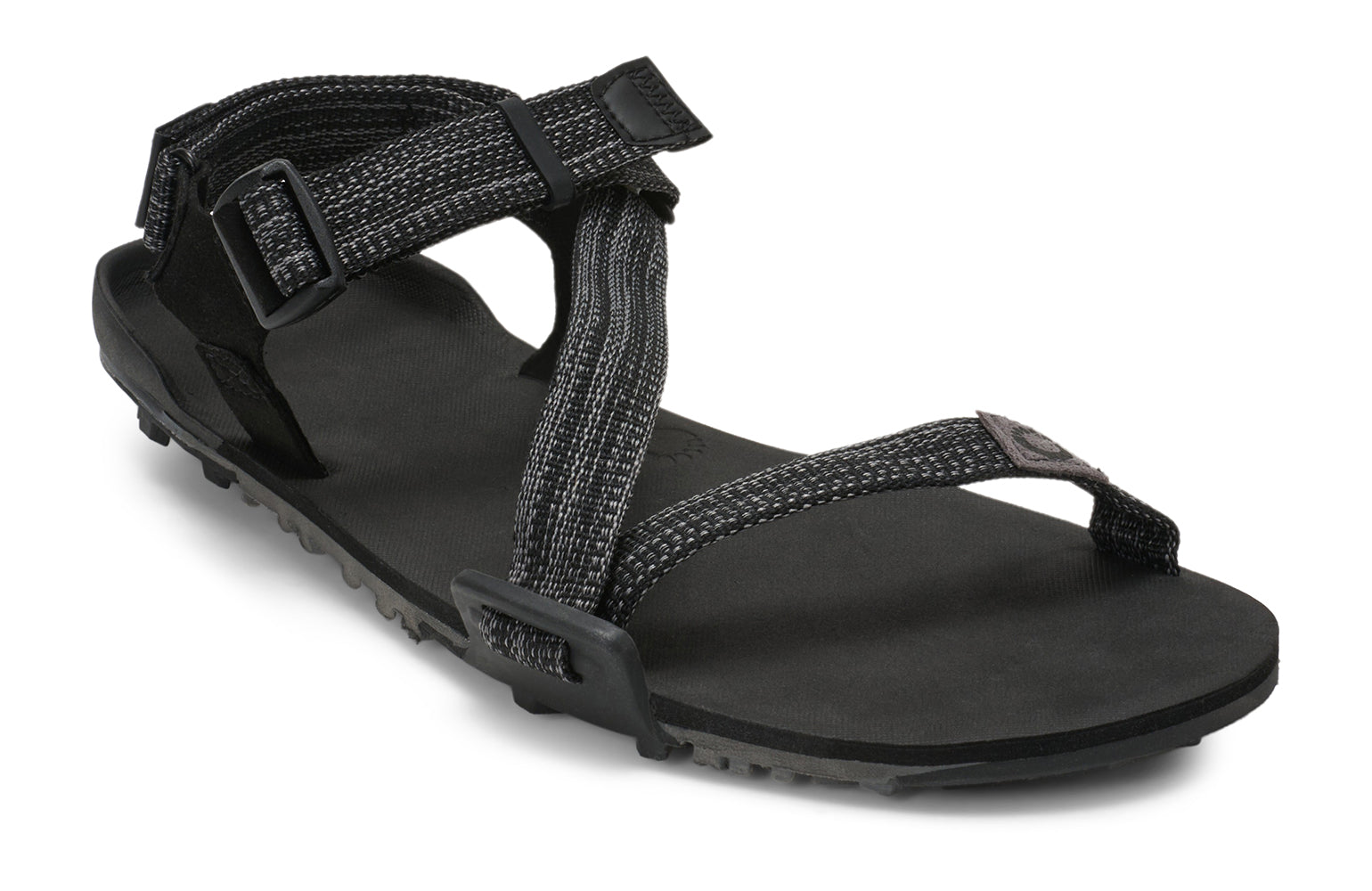 Xero Barefoot Shoes sold in Ontario, Canada. These minimalist shoes have flexible soles, wide toe boxes, and zero drop. Angled view of Xero Men's Z-Trail EV in Multi-Black. Trail hiking, running, and recovery sandal. 