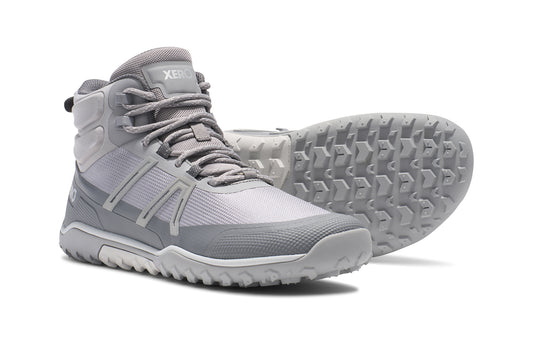 Xero Barefoot Shoes sold in Ontario, Canada. These minimalist shoes have flexible soles, wide toe boxes, and zero drop. Side and sole view of Xero Women's Scambler Trail Mid in Alloy/Steel Gray, a lightweight hiking boot