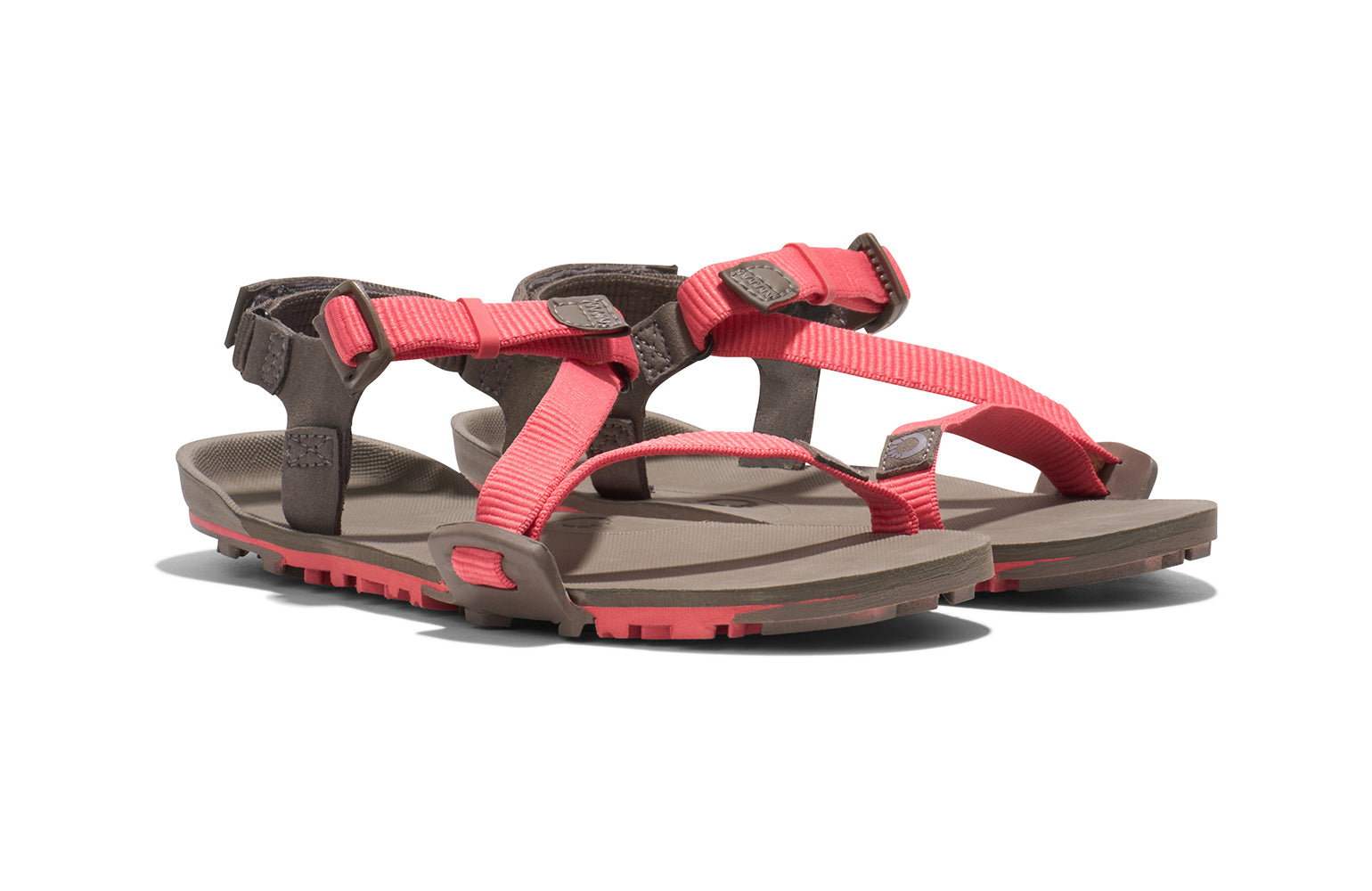 Xero Barefoot Shoes sold in Ontario, Canada. These minimalist shoes have flexible soles, wide toe boxes, and zero drop. Angled view of Xero Women's Z-Trail EV in Sunset Coral/Morel. Trail hiking, running, and recovery sandal. 