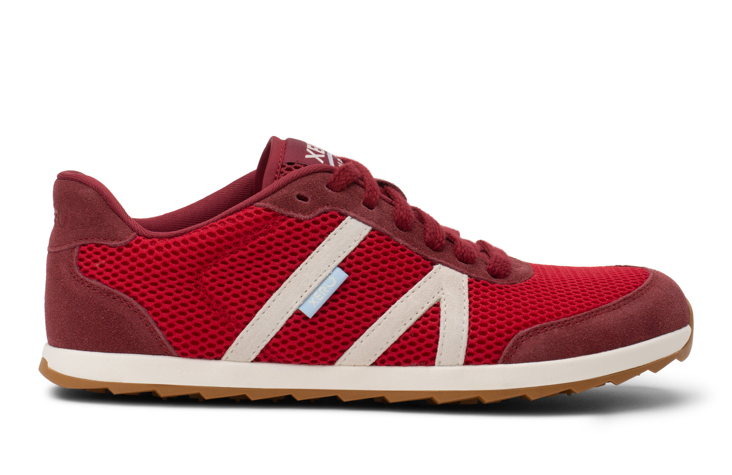 Red sneaker with a white sole on a white background. Tru Stride Co brings Xero Shoes to Canada