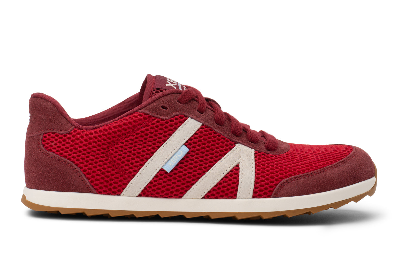Red sneaker with a white sole on a white background. Tru Stride Co brings Xero Shoes to Canada