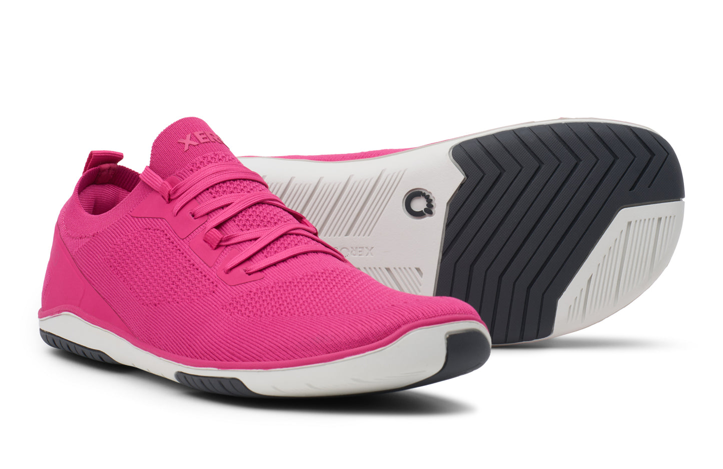 Pink athletic shoe with a white and black sole on a white background.  Tru Stride Co brings Xero Shoes to Canada