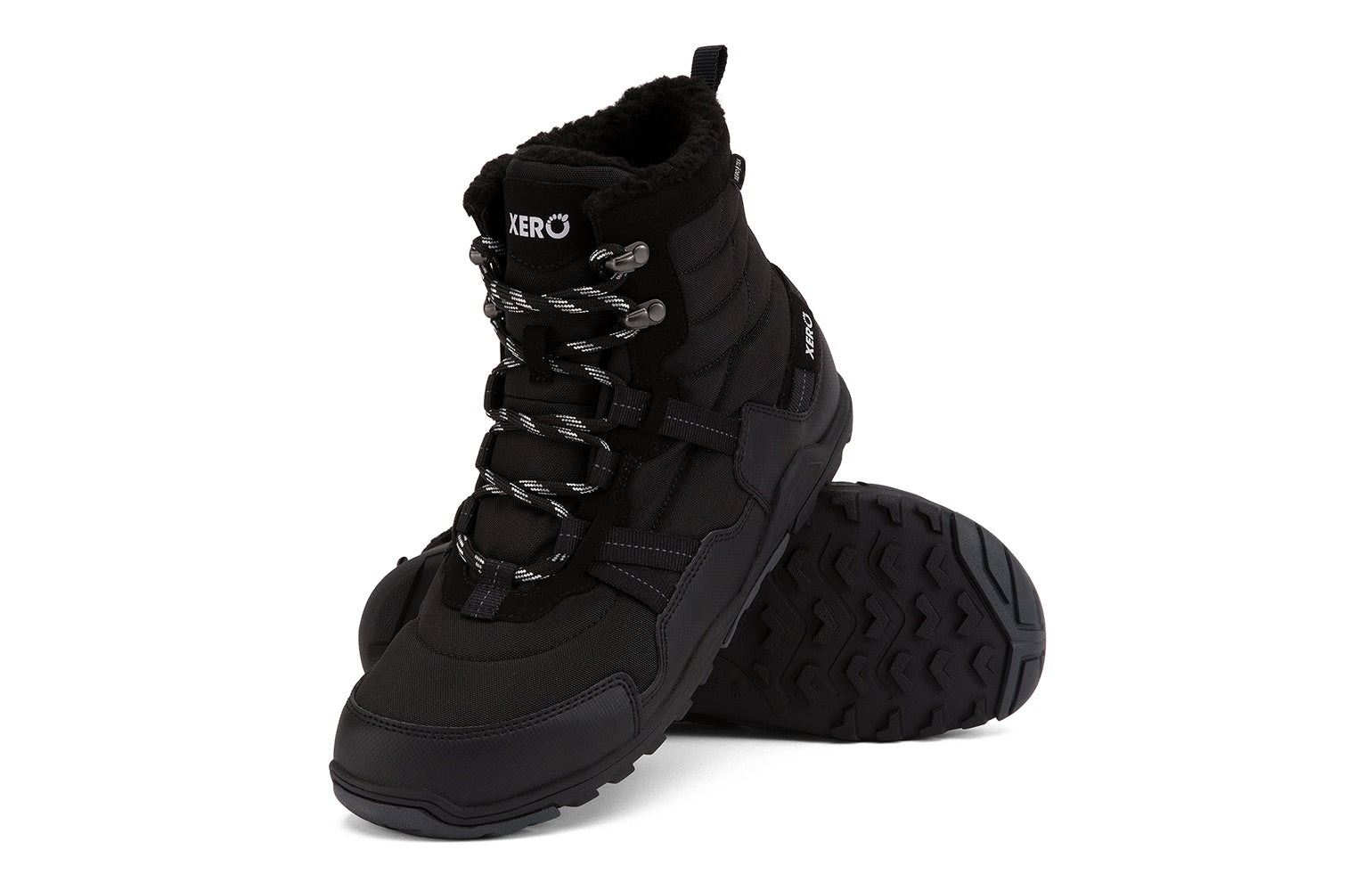 Xero Shoes Canada, specifically men’s barefoot shoes Canada. These minimalist shoes have flexible soles, wide toe boxes, and zero drop. Angled pair view of Xero Men's Alpine in Black. Waterproof, lightweight snow boot. 