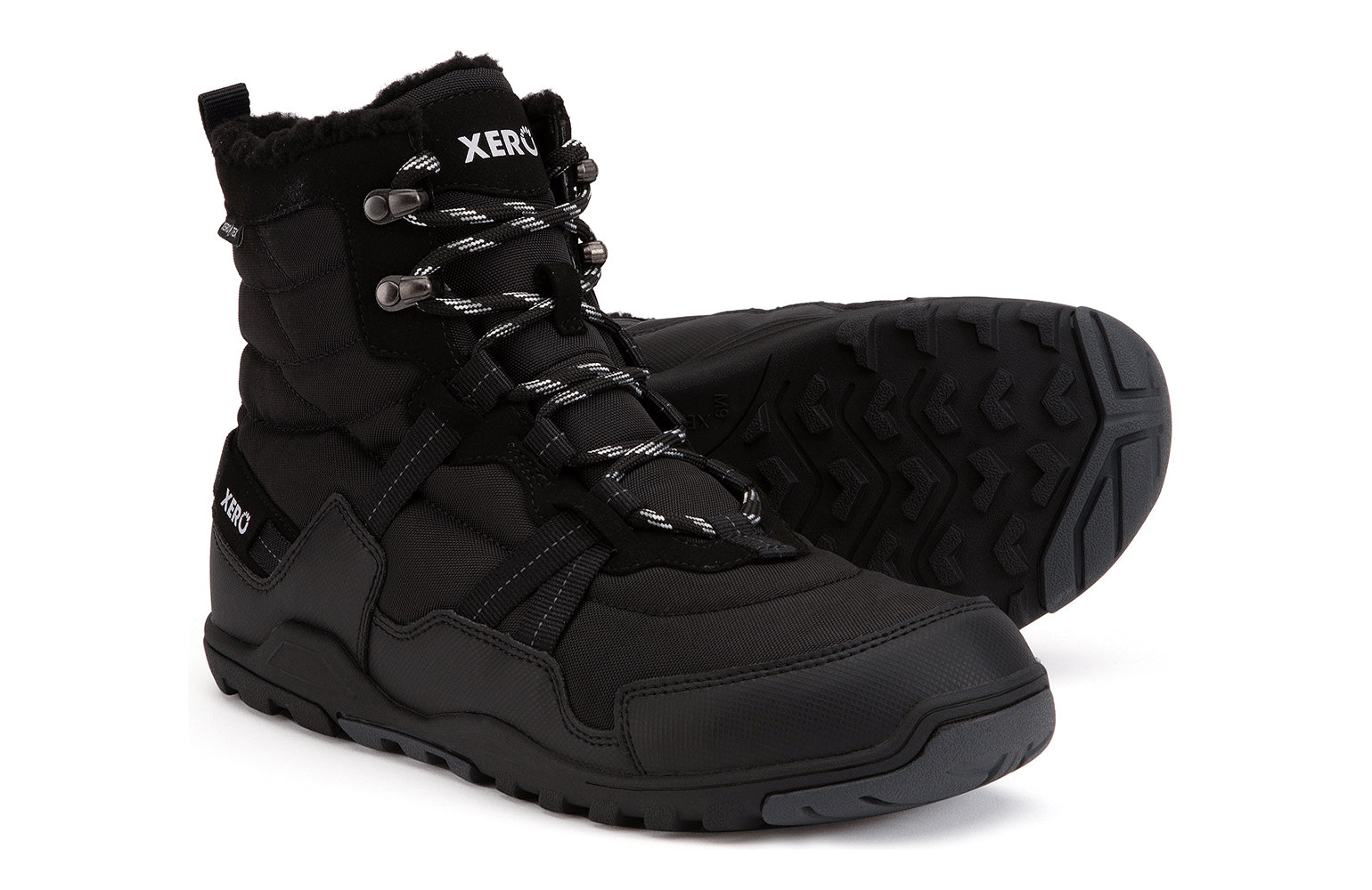 Xero Shoes Canada, specifically men’s barefoot shoes Canada. These minimalist shoes have flexible soles, wide toe boxes, and zero drop. Side and sole pair view of Xero Men's Alpine in Black. Waterproof, lightweight snow boot. 