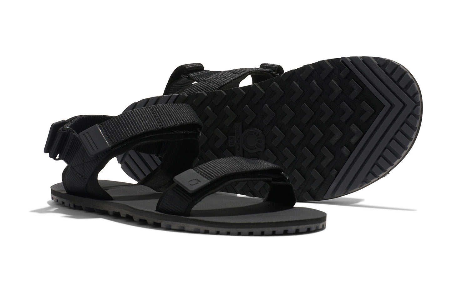 Xero Shoes Canada, specifically men’s barefoot shoes Canada. These minimalist shoes have flexible soles, wide toe boxes, and zero drop. Pair view of Xero Men's D-Trail in Black/Asphalt, a versatile hiking sandal.
