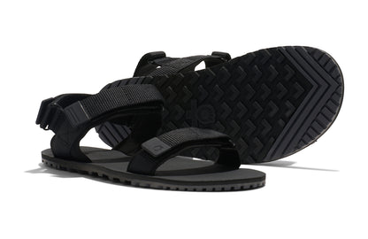 Xero Shoes Canada, specifically men’s barefoot shoes Canada. These minimalist shoes have flexible soles, wide toe boxes, and zero drop. Pair view of Xero Men's D-Trail in Black/Asphalt, a versatile hiking sandal.