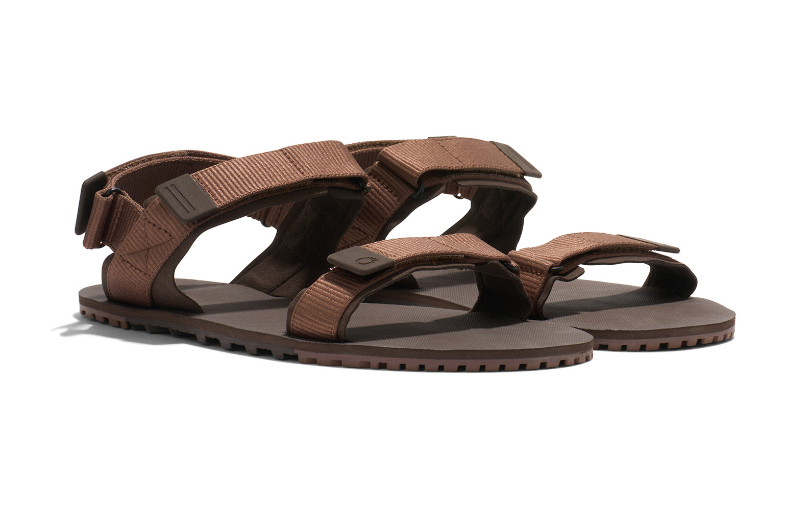 Xero Shoes Canada, specifically men’s barefoot shoes Canada. These minimalist shoes have flexible soles, wide toe boxes, and zero drop. Angled view of Xero Men's D-Trail in Cocoa Brown/Java Brown, a versatile hiking sandal.