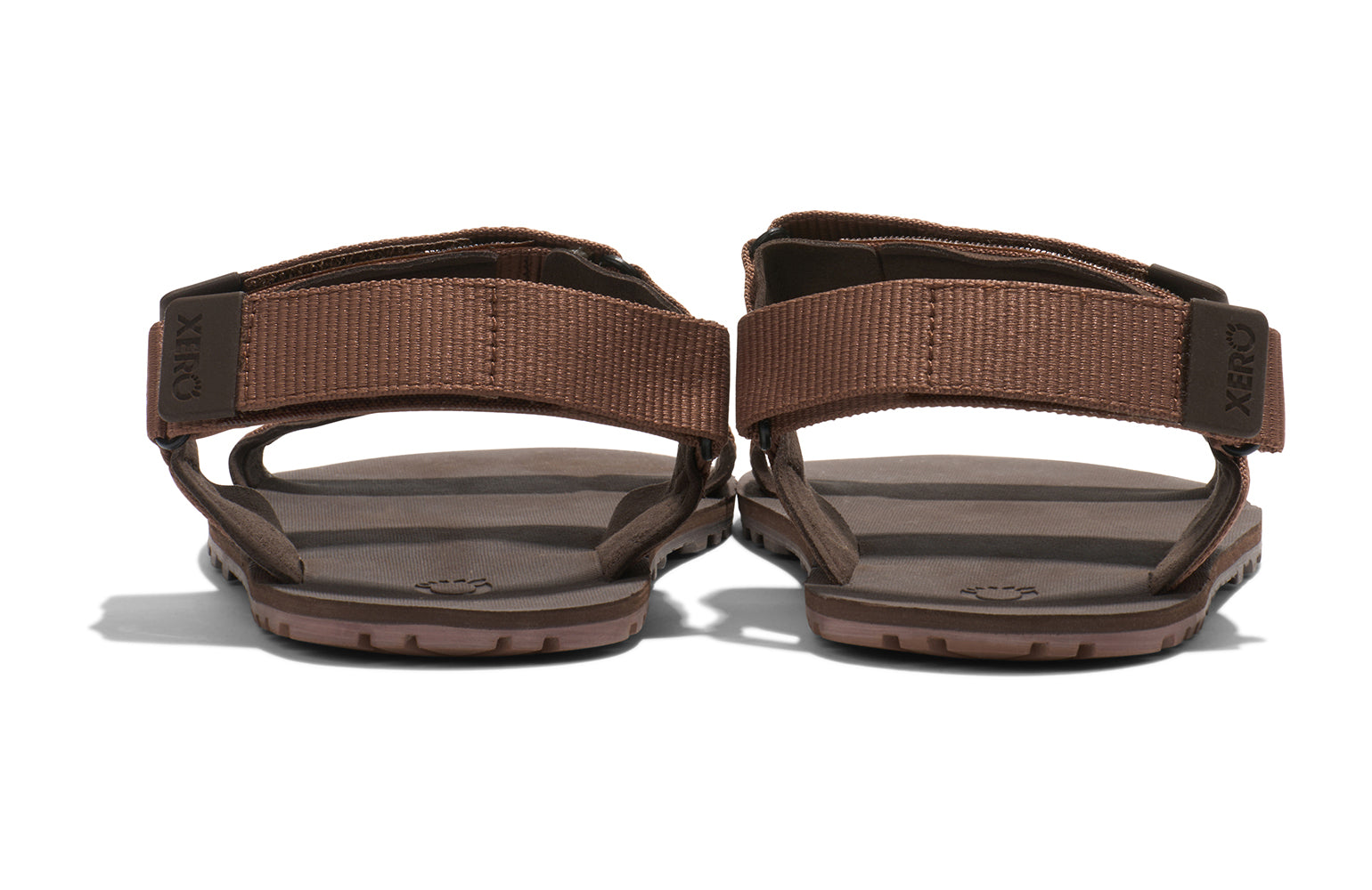 Xero Shoes Canada, specifically men’s barefoot shoes Canada. These minimalist shoes have flexible soles, wide toe boxes, and zero drop. Back view of Xero Men's D-Trail in Cocoa Brown/Java Brown, a versatile hiking sandal.