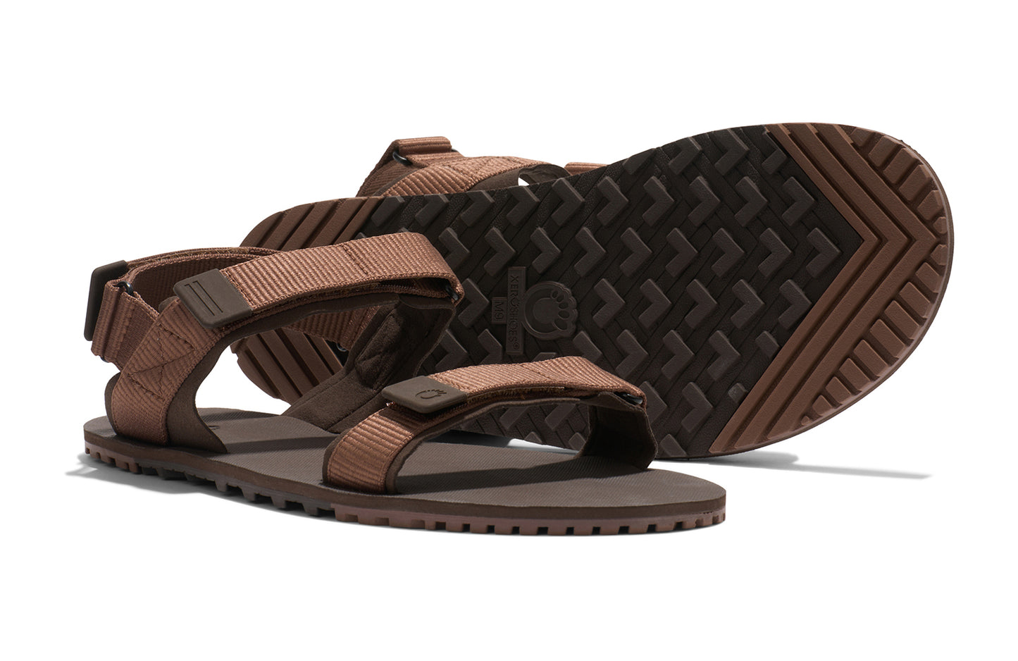Xero Shoes Canada, specifically men’s barefoot shoes Canada. These minimalist shoes have flexible soles, wide toe boxes, and zero drop. Pair view of Xero Men's D-Trail in Cocoa Brown/Java Brown, a versatile hiking sandal.