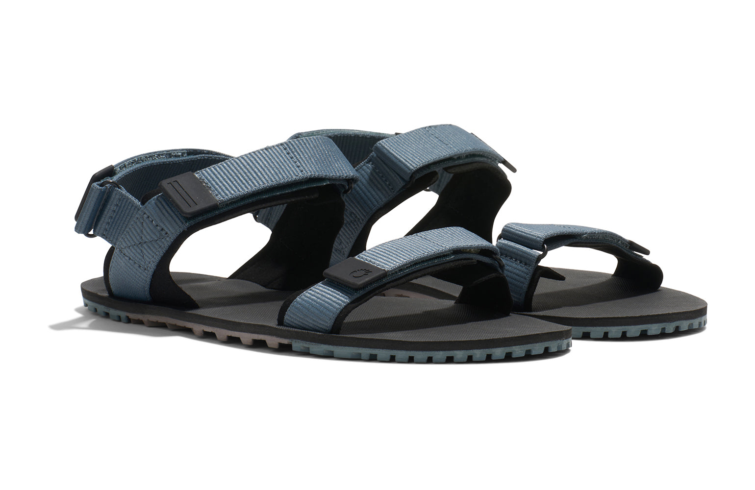 Xero Shoes Canada, specifically men’s barefoot shoes Canada. These minimalist shoes have flexible soles, wide toe boxes, and zero drop. Angled view of Xero Men's D-Trail in Stormy Weather/Black, a versatile hiking sandal.