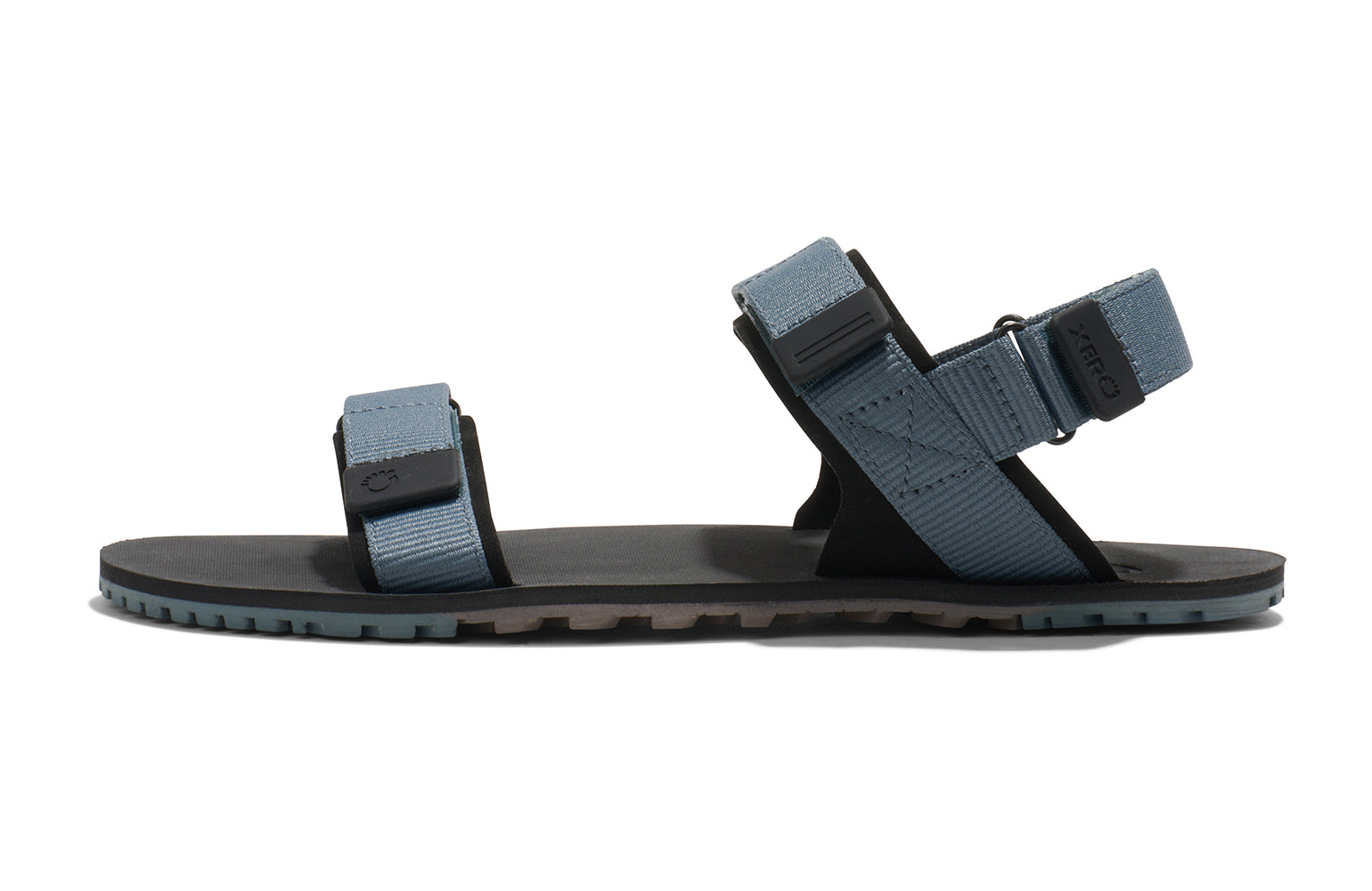 Xero Shoes Canada, specifically men’s barefoot shoes Canada. These minimalist shoes have flexible soles, wide toe boxes, and zero drop. Side view of Xero Men's D-Trail in Stormy Weather/Black, a versatile hiking sandal.
