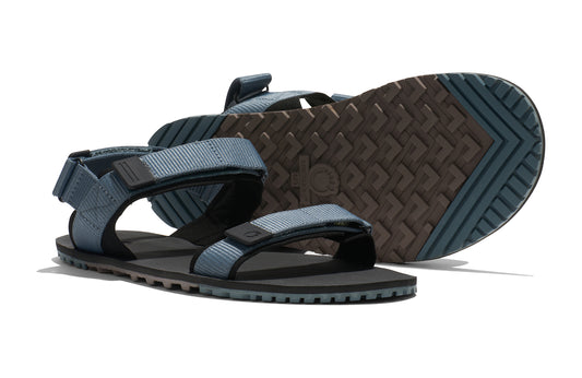 Xero Shoes Canada, specifically men’s barefoot shoes Canada. These minimalist shoes have flexible soles, wide toe boxes, and zero drop. Pair view of Xero Men's D-Trail in Stormy Weather/Black, a versatile hiking sandal.