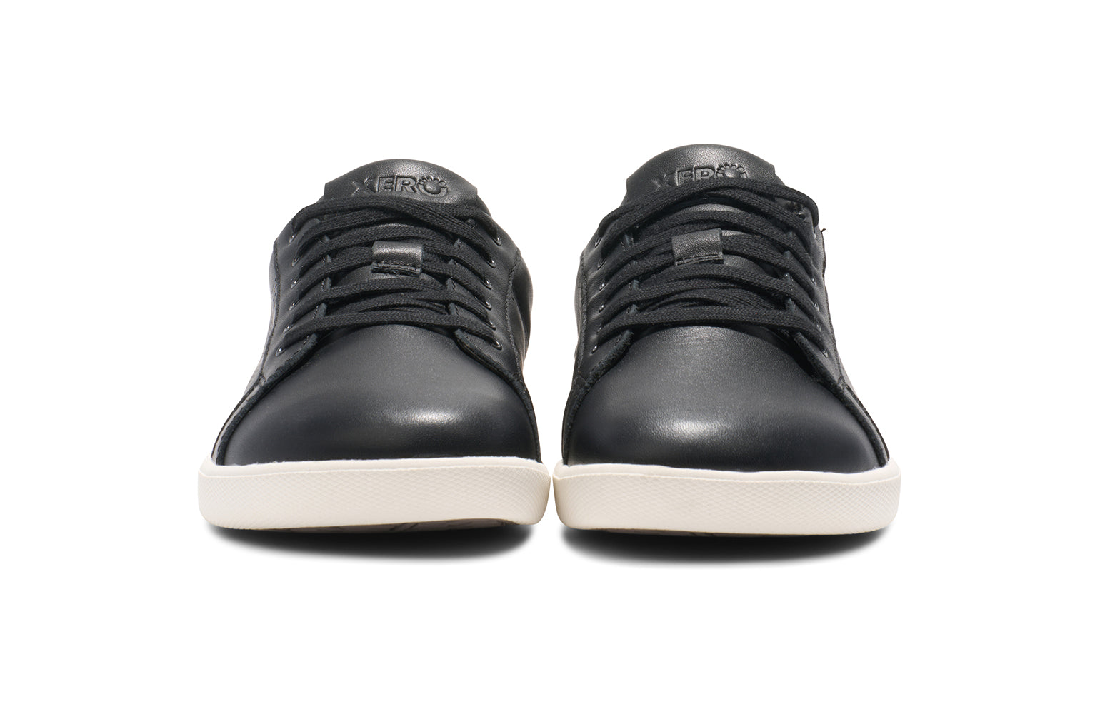 Xero Shoes Canada, specifically men’s barefoot shoes Canada. These minimalist shoes have flexible soles, wide toe boxes, and zero drop. Front view of Dillon Leather in Black. A classic leather sneaker. 