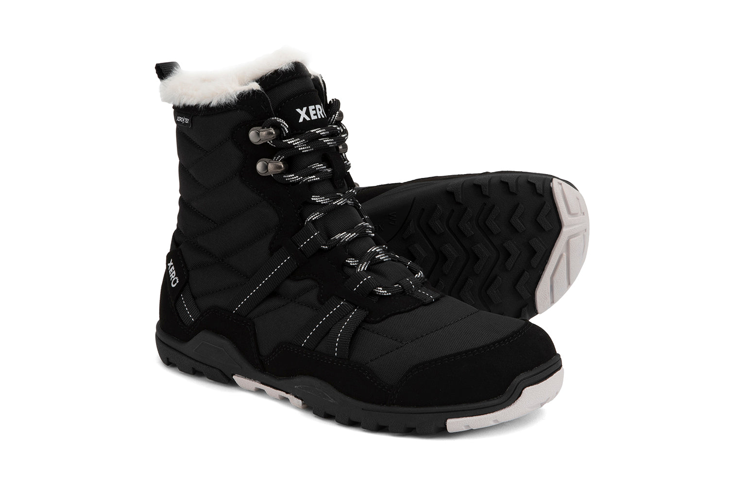 Xero Shoes Canada, specifically women’s barefoot shoes Canada. These minimalist shoes have flexible soles, wide toe boxes, and zero drop. Side and sole pair view of Xero Women's Alpine in Black. Waterproof, lightweight snow boot. 