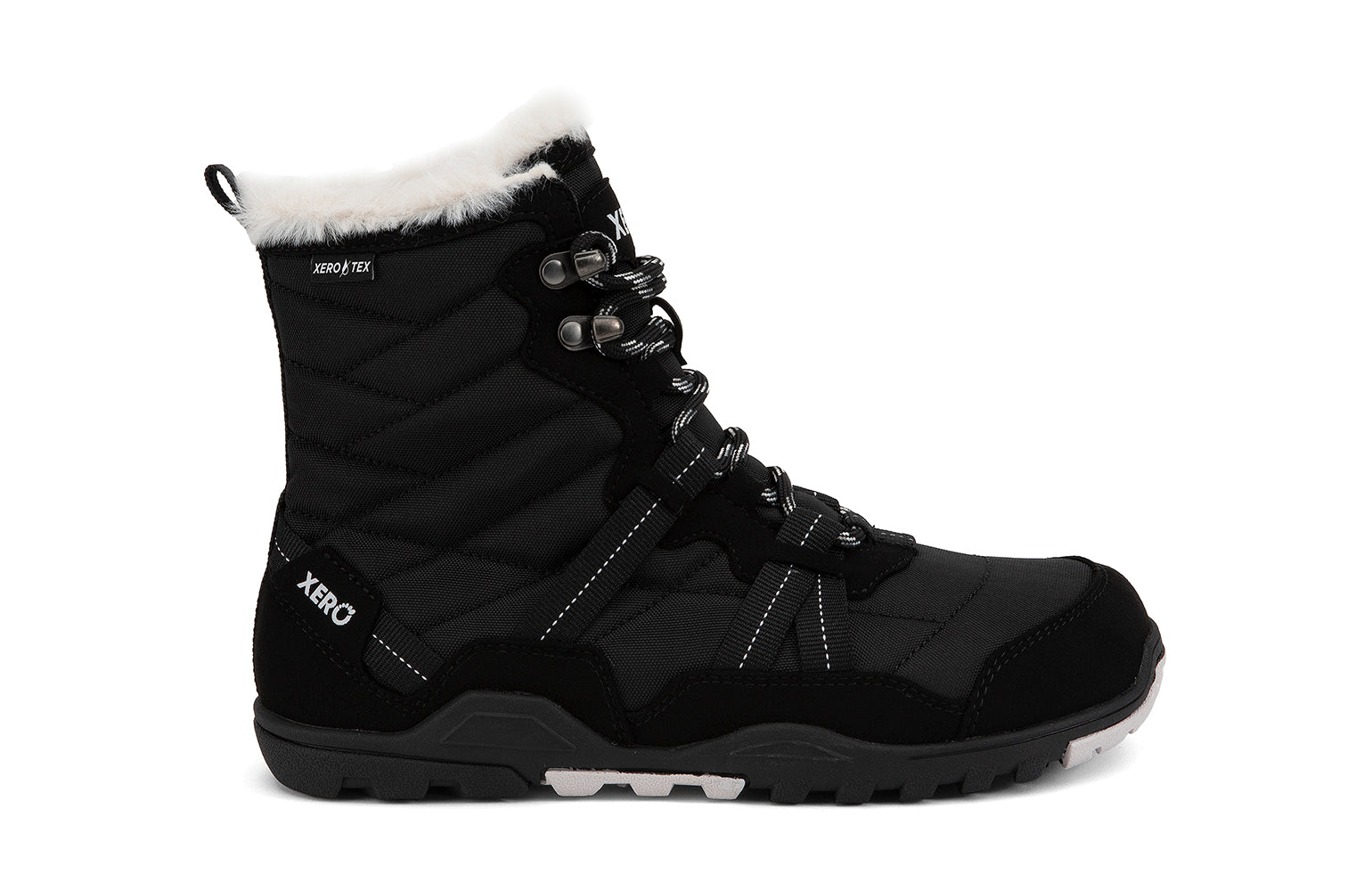 Xero Shoes Canada, specifically women’s barefoot shoes Canada. These minimalist shoes have flexible soles, wide toe boxes, and zero drop. Lateral side view of Xero Women's Alpine in Black. Waterproof, lightweight snow boot. 