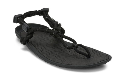 Xero Shoes Canada, specifically women’s barefoot shoes Canada. These minimalist shoes have flexible soles, wide toe boxes, and zero drop. Angled view of Xero Women's Aqua Cloud in Black. Versatile water sport and hiking sandal. 