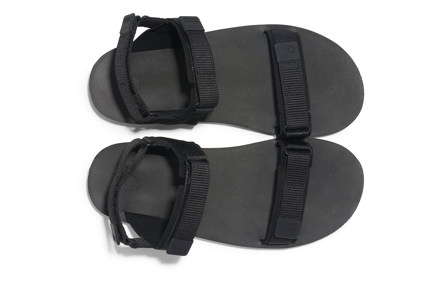 Xero Shoes Canada, specifically women’s barefoot shoes Canada.  These minimalist shoes have flexible soles, wide toe boxes, and zero drop. Top view of Xero Women's D-Trail in Black/Asphalt, a versatile hiking sandal.
