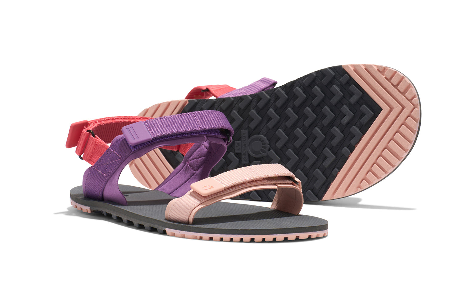 Xero Shoes Canada, specifically women’s barefoot shoes Canada. 
 These minimalist shoes have flexible soles, wide toe boxes, and zero drop. Pair view of Xero Women's D-Trail in Dewberry Multi, a versatile hiking sandal.