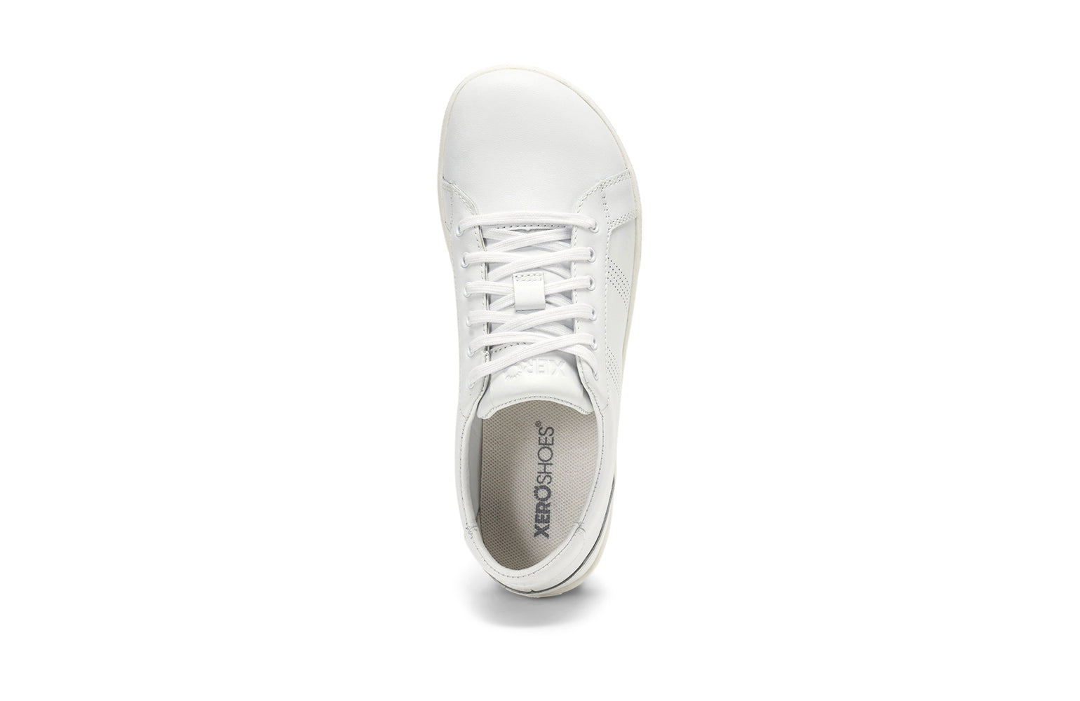 Xero Shoes Canada, specifically women’s barefoot shoes Canada. These minimalist shoes have flexible soles, wide toe boxes, and zero drop. Top view of Women's Dillon Leather in White. A classic leather sneaker. 
