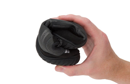 Xero Shoes Canada, specifically barefoot running shoes Canada. These minimalist shoes have flexible soles, wide toe boxes, and zero drop. Curled view of Xero Women's 360s in Asphalt/Gray. A cross-training shoe. 