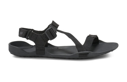 Xero Shoes Canada, specifically men’s barefoot shoes Canada. These minimalist shoes have flexible soles, wide toe boxes, and zero drop. Lateral side view of Xero Men's Z-Trek in Black, a lightweight packable sport sandal. 
