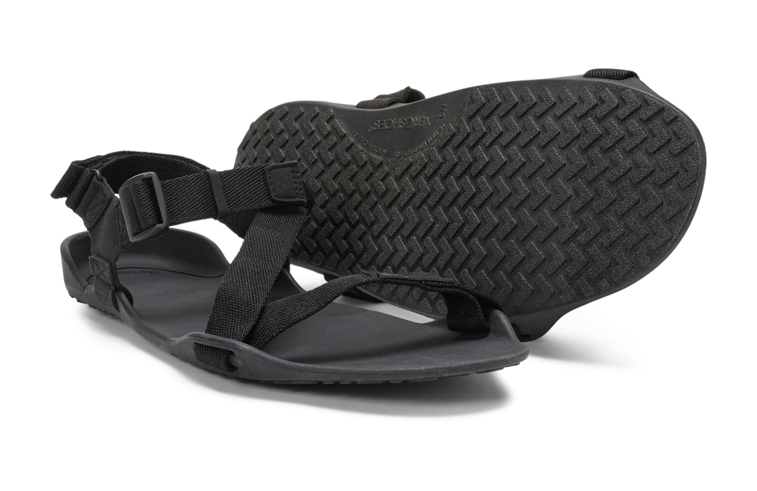 Xero Barefoot Shoes sold in Ontario, Canada. These minimalist shoes have flexible soles, wide toe boxes, and zero drop. Pair view of Xero Men's Z-Trek in Black, a lightweight packable sport sandal. 