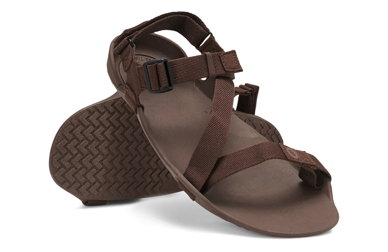 Xero Barefoot Shoes sold in Ontario, Canada. These minimalist shoes have flexible soles, wide toe boxes, and zero drop. Angled pair view of Xero Men's Z-Trek in Brown, a lightweight packable sport sandal. 
