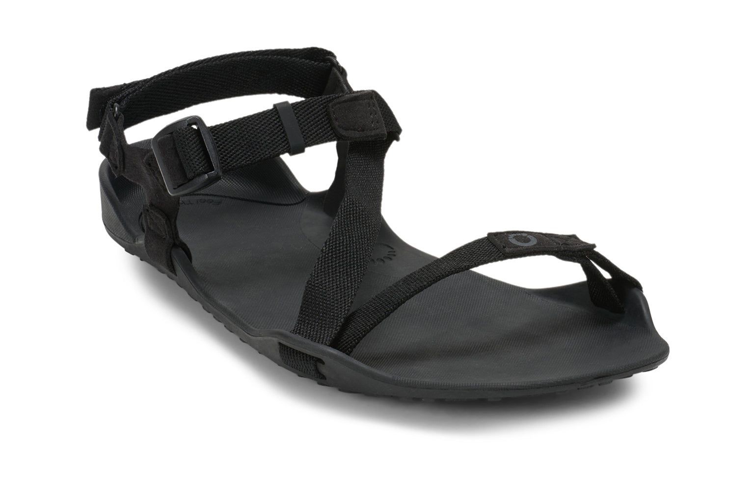 Xero Barefoot Shoes sold in Ontario, Canada. These minimalist shoes have flexible soles, wide toe boxes, and zero drop. Angled view of Xero Women's Z-Trek in Black, a lightweight packable sport sandal. 