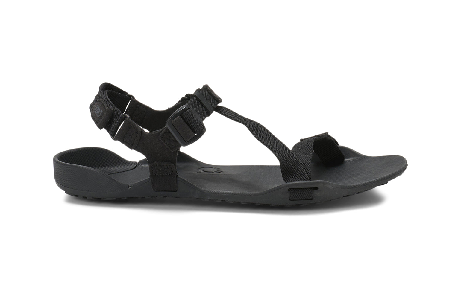 Xero Barefoot Shoes sold in Ontario, Canada. These minimalist shoes have flexible soles, wide toe boxes, and zero drop. Side view of Xero Women's Z-Trek in Black, a lightweight packable sport sandal. 