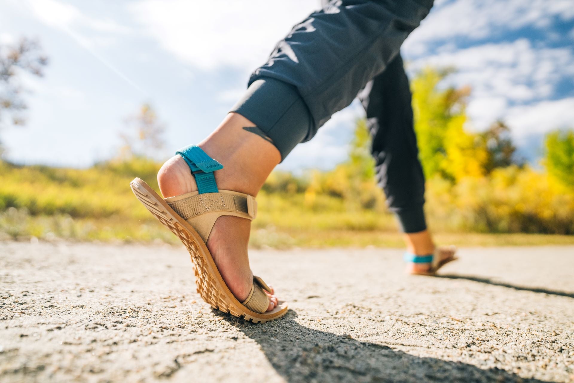 Xero Shoes Canada, specifically women’s barefoot shoes Canada. Woman wearing D-trail while on a trail